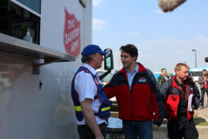 The Prime Minister thanks Major Ron Cartmell (Divisional Commander for Alberta & Northern Territories) for the word of tThe Salvation Army. Photo by Captain Pam Goodyear, Salvation Army