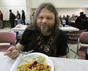 A regular patron enjoys his meal.