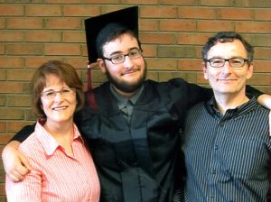 Peter with his proud parents at High School Graduation